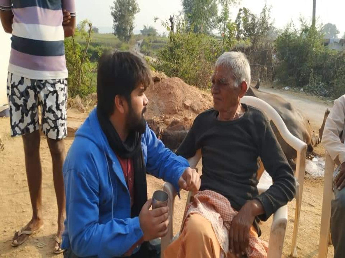 Political Mitra volunteers speaking with local voters during a ground campaign