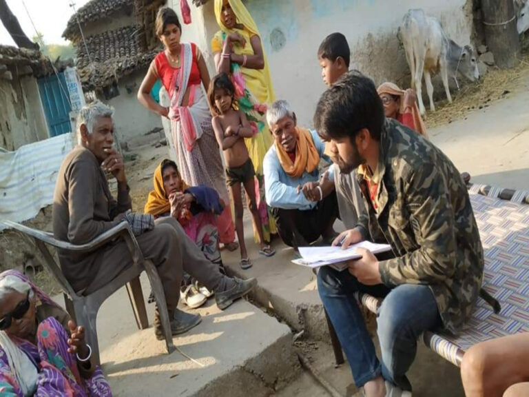 Voters engaging with volunteers during a door-to-door ground campaign for Tejaswi Yadav in Bihar