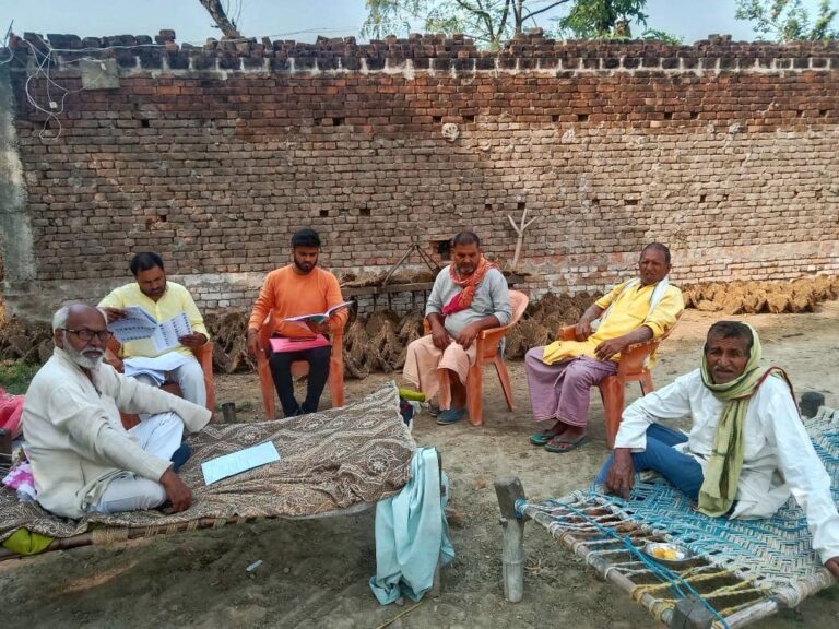 Door-to-door campaigning by volunteers in Madhya Pradesh to inform voters about upcoming election dates and candidates